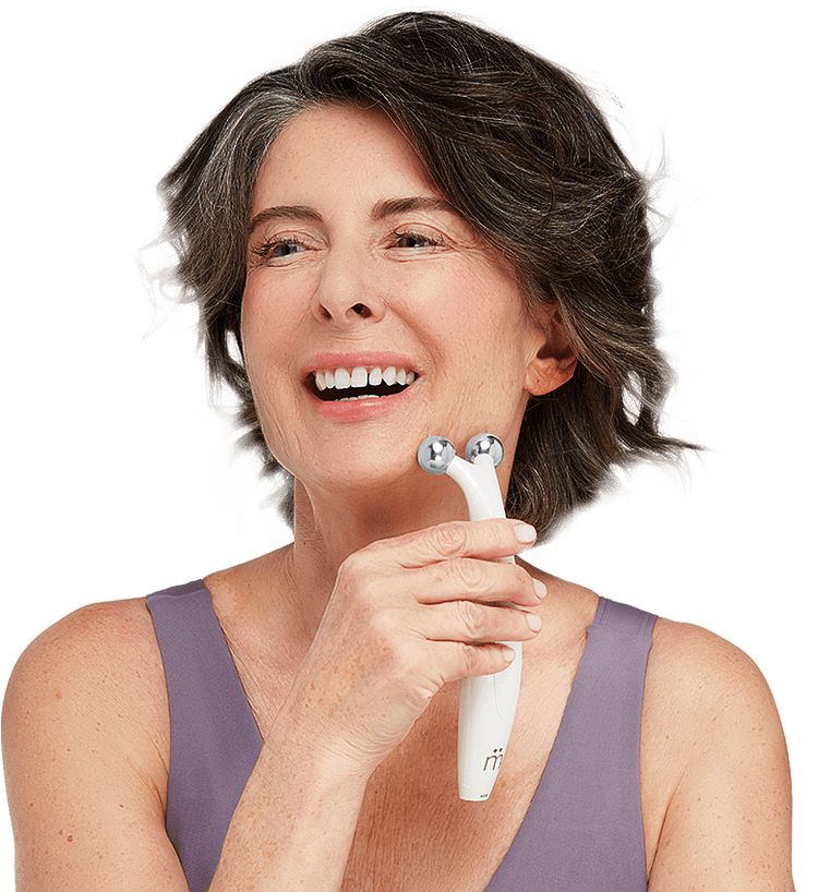 Photo of a woman receiving a MyoLift microcurrent facial treatment, demonstrating the device in use.